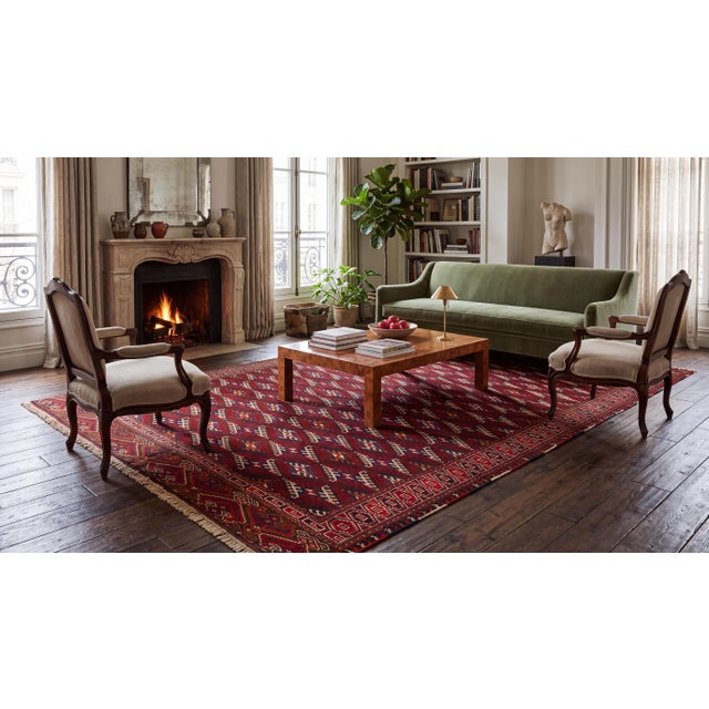 Hand-knotted from high-grade natural wool, this authentic antique Turkmen Yamoud rug features a striking all-over diamond...