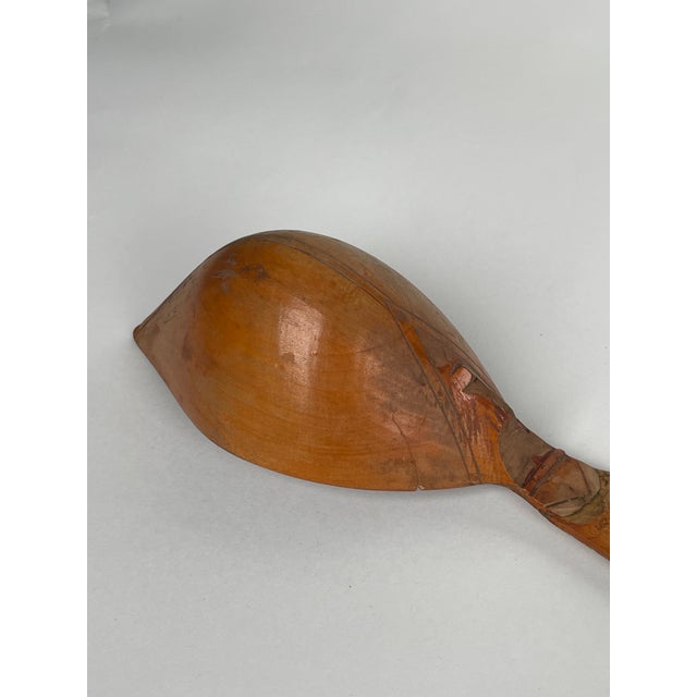 A Persian Qajar Hand Carved Wooden Sherbet Spoon. Iran, Circa 1880. The intricate carving, often with pierced and relief...