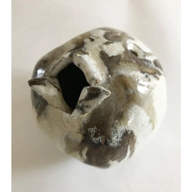 This unique studio pottery vase has a great shape and beautiful neutral glaze colors. Functional and decorative! Marked...