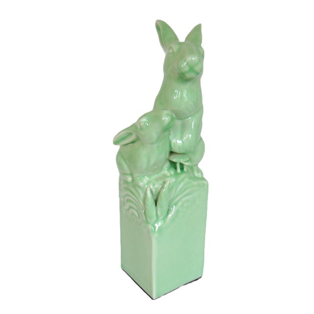 A charming sculpture of two rabbits with a beautiful celadon glaze. The sculpture stands 14" high, 4" wide, 4" deep. Very...