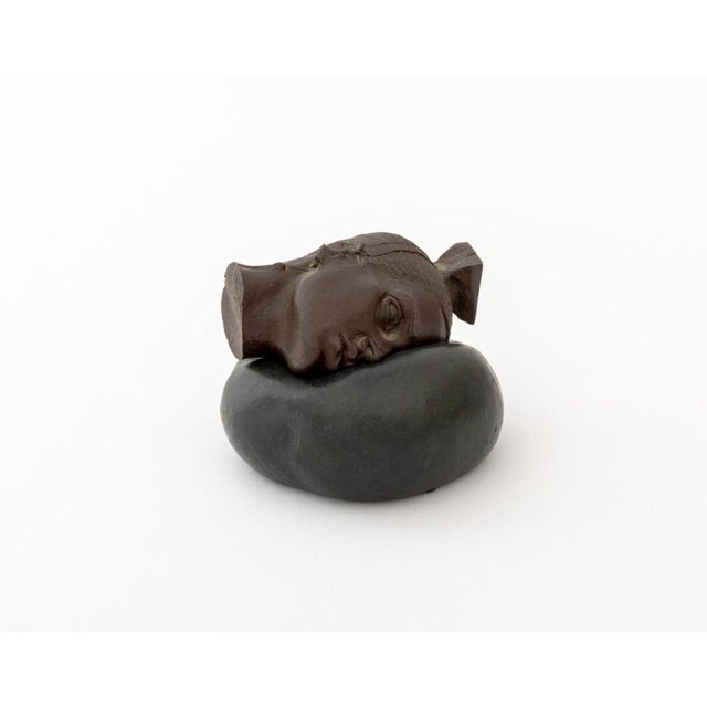 Robert Graham (Mexican/American, 1938-2008) Untitled (Woman's Head on Pillow) Patinated Bronze Sculpture, 2002, in two...