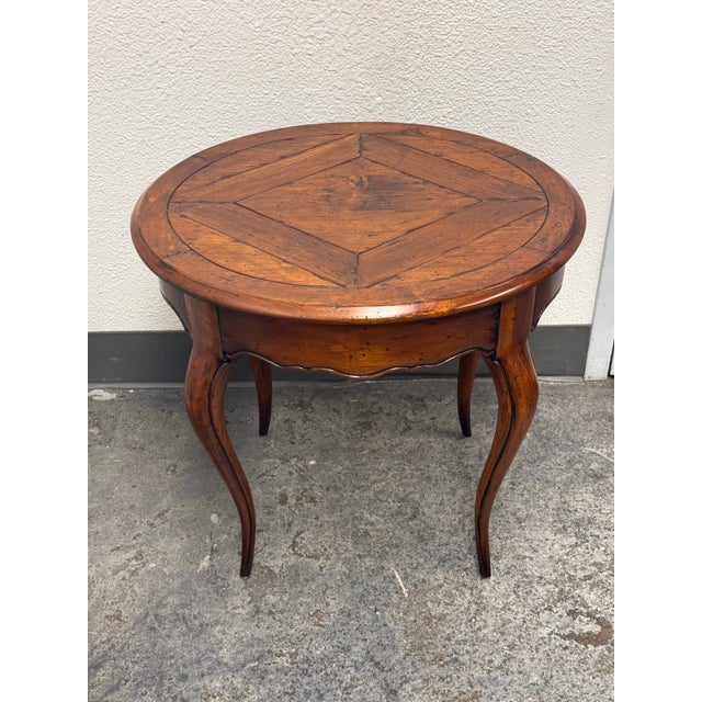 Design Plus Gallery presents a Vintage Round Parquetry Pull-Out Side Table by Acquisitions by Henredon. This round wood...