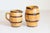 Two rustic French pottery pitchers from the 19th century, with yellow glaze, brown accents and back handles. They are...