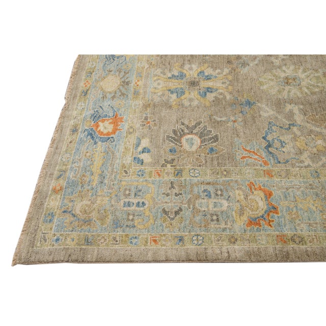 This beautifully handwoven oriental rug, featuring a classic central medallion and intricate floral and geometric...