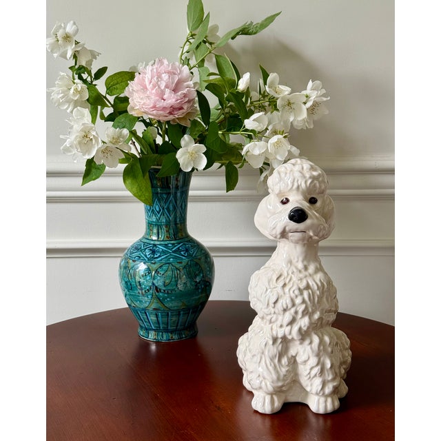 This handmade ceramic dog is adorable for anyone who likes white poodles or dogs. Its delightful for a child’s space or...