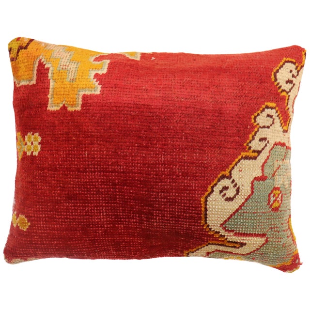 Pillow made from an antique Turkish Oushak rug from the early 20th century. Measures: 19" x 25".