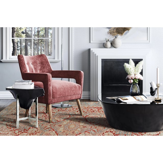 Beautiful Heriz hand-knotted wool rug with a red field and blue frame. This rug has multi-color accents in all-over...