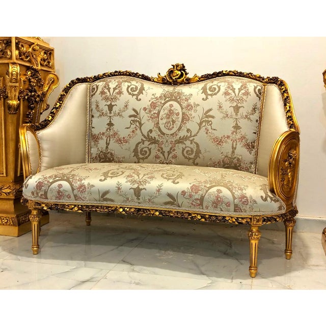 Bring timeless French elegance to your interior with this French Louis XVI-inspired sofa, featuring an intricately carved...