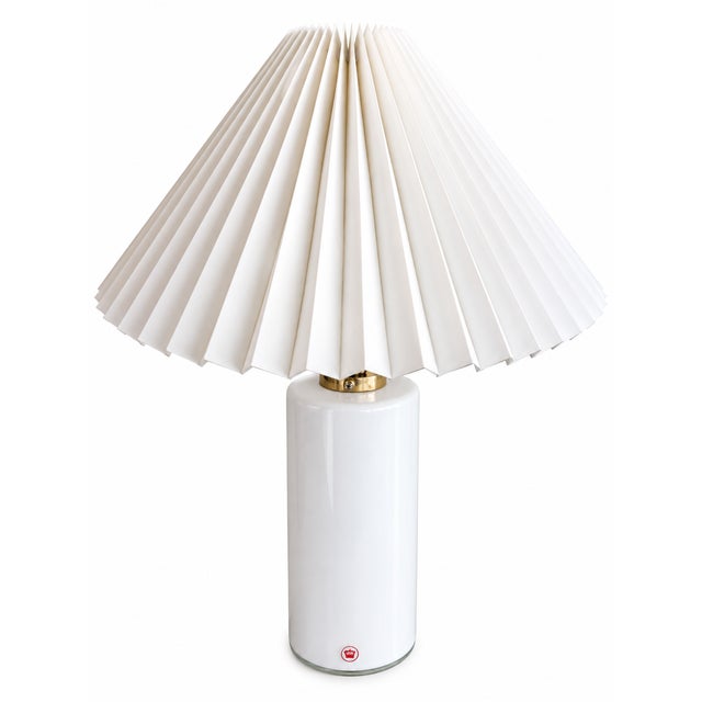 Elegant vintage Danish table lamp dating from the 1970s, featuring a beautifully simple cylindrical base in white opaline...