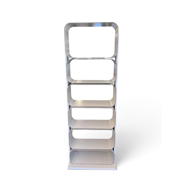 A striking set of freestanding Space Age aluminium shelves, showcasing a sleek sculptural design inspired by the...