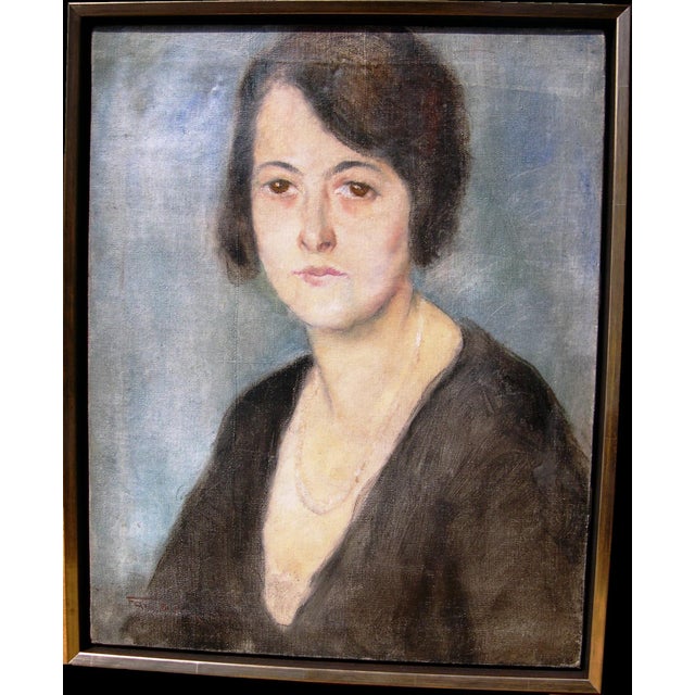 Pál Fried 1893 Budapest - 1976 New York City Three-quarter portrait of a young, dark-haired woman with a black top and...