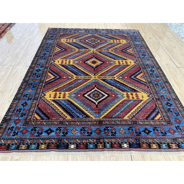 Hand-knotted in wool, this vintage rug showcases the bold, graphic design associated with Lori Pambak Kazak weavings from...
