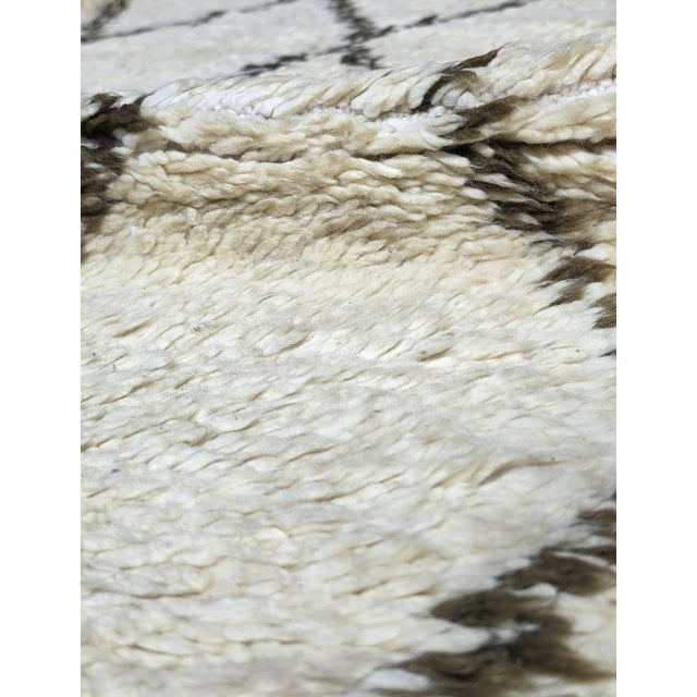 Vintage Beni Ourain Rug | Handwoven Wool Rug with Diamond Lattice Pattern This vintage Beni Ourain rug showcases the...