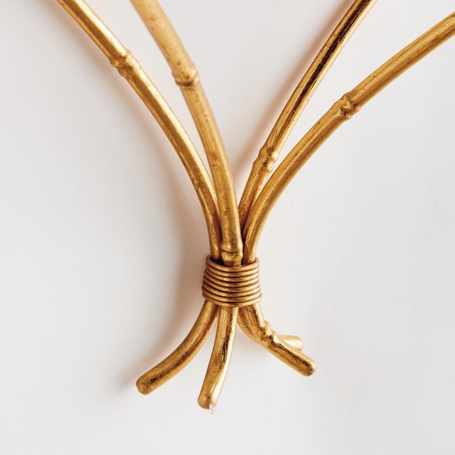 This mirrored wall bracket is a contemporary take on classic chinoiserie style. Smooth and refined, it is scaled to work...