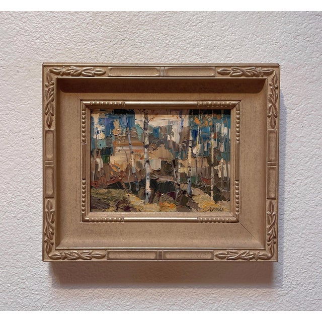 This oil on panel artwork captures a serene autumn landscape, where slender birch trees stand amidst a mosaic of earthy...