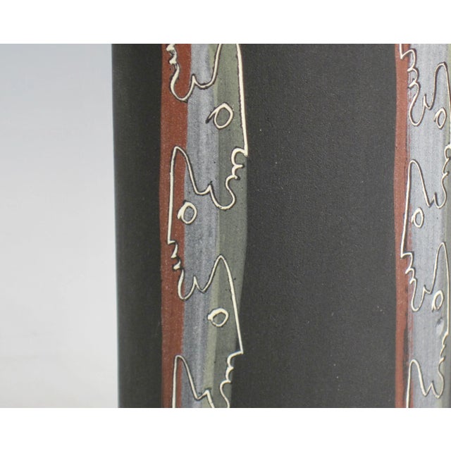 A mid-century tiki vase by artist duo Charles and Alice Smith known as Chalice. This vase has alternating incised tiki...