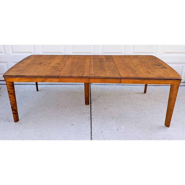 Warm wood tones, expressive grain, and sculptural chair backs give this vintage Heywood-Wakefield dining set its...