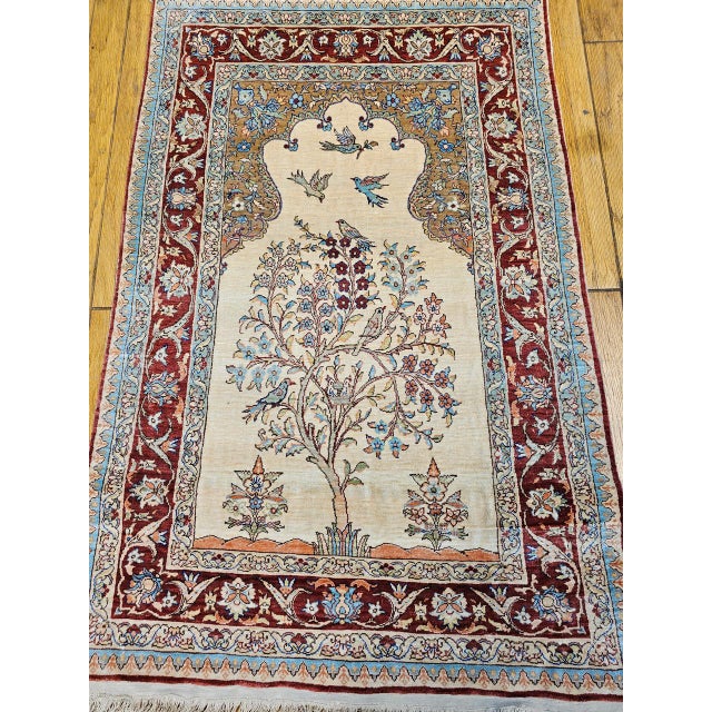 A magnificent Turkish silk Kayseri rug from the late 20th century, finely handwoven in an intricate Tree of Life pictorial...