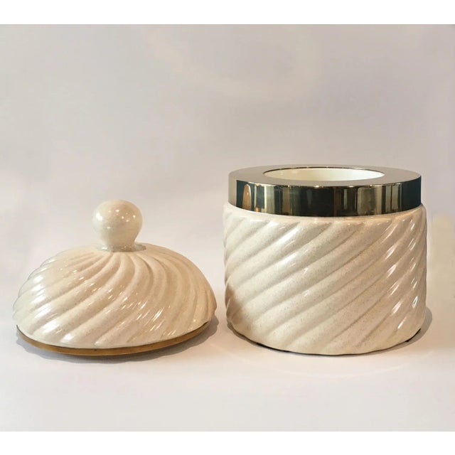 Elegant oversized ice bucket designed by Tommaso Barbi in Italy during the 1970s. Made of white glazed ceramic, it...