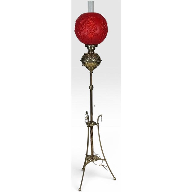 Victorian Brass and Red Satin Glass Griffin Piano Floor Lamp This spectacular authentic Victorian floor lamp stands as a...