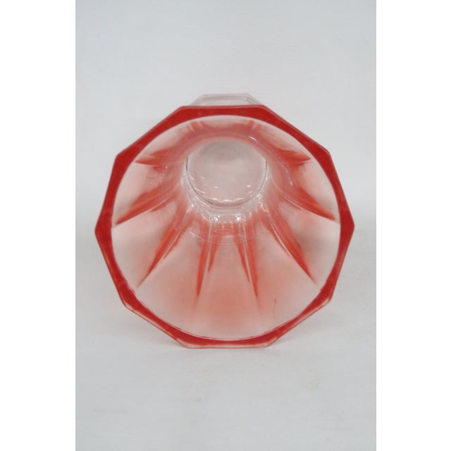 This gorgeous Ribbed Vase is made of thick paneled glass. This vase has a lovely silhouette with a slim base curving...
