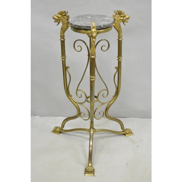 Antique Italian Renaissance Brass Figural Dragon Pedestal Plant Stand. Item features a black marble top, paw foot tripod...