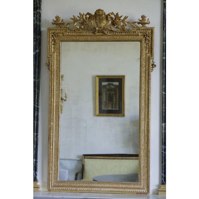 Large Napoleon III style mirror, marked by its eclecticism, between baroque opulence and rigorous symmetry. Shapes &...