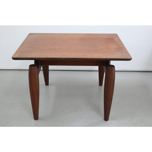 Made in Denmark Small teak coffee or side table Solid yet exceptionally elegant design Made in Denmark, 1960s Height 38cm...
