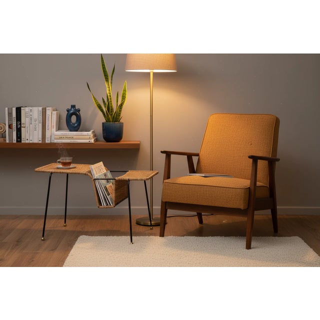 The Ledger Magazine Table brings mid-century modern elegance to your living space with handcrafted rattan construction and...