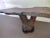 This console table is made from a slab of walnut would that sits on a tree log The size of it makes it outstanding...