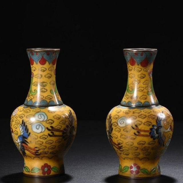 This is a beautiful pair of vintage cloisonné enamel vases, featuring a classic baluster form with a flared mouth. The...