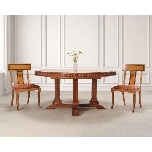 A handsome round oak "Hither Hills" extending dining table made by Ralph Lauren. The Palladian style table features a...