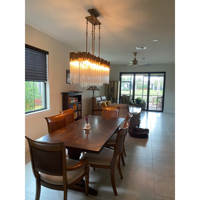 This Varaluz Matrix 8 light linear Chandelier/Pendant Light Fixture is in Excellent Condition. A bold contemporary...