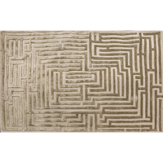 Walk the maze with the Anatolia geometric handmade rug design, named after the birthplace of the ancient word for...