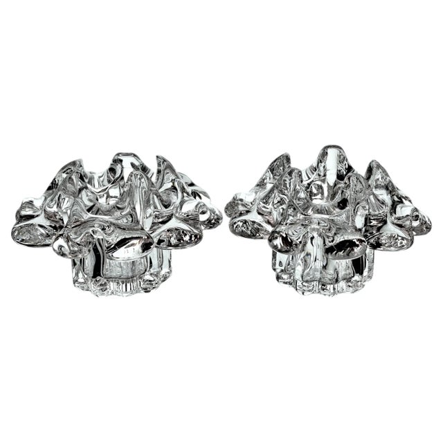 Wow! This a a gorgeous and sparkly flower shaped candleholder. Made of many multi faceted petal shaped crystals that cast...