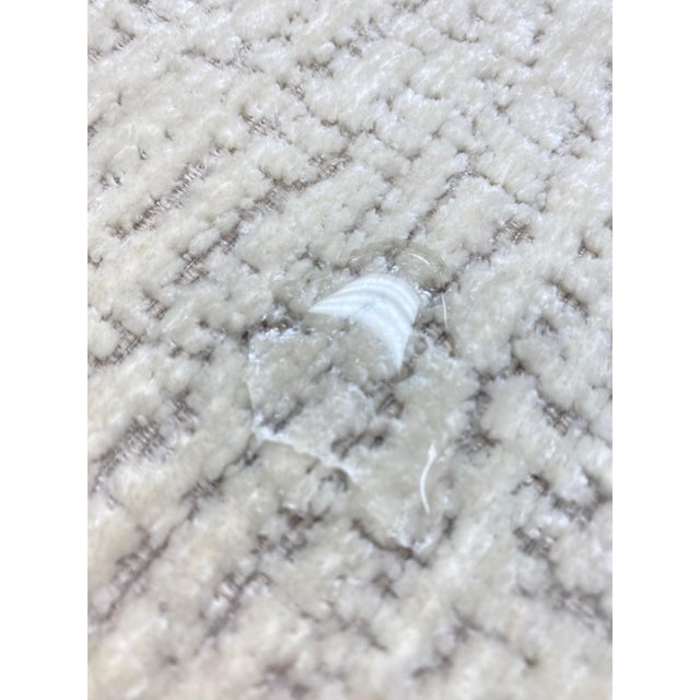 57" wide designer luxury textured velvet water & stain resistant upholstery fabric in ivory and taupe. Price is per yard.