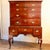 A George I period highboy of fine matched burl walnut timber, herring bone banding and cross-grained moldings, this ca....