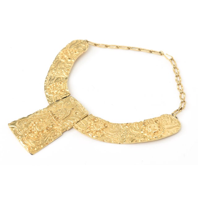 This early vintage fabulous gold plated collar necklace is by Kenneth Jay Lane and in the style of Egyptian Etruscan and a...