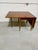 This Stickley Furniture Company cherry drop-leaf table is dated on the label 1953. This table features a cherry plank top...