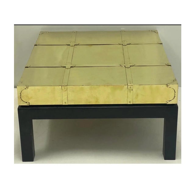 Sarreid Ltd. coffee table dating to the 1970s. It is unique in that it combines low profile modern styling with Asian and...