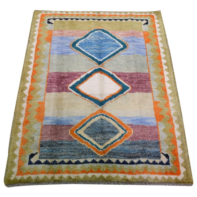 Hand-knotted with care using traditional rug making techniques, this wool rug blends timeless craftsmanship with a modern...