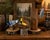 Charming vintage set of three hand-carved and hand-painted wooden bird sculptures depicting a Blue Jay, woodpecker, and...