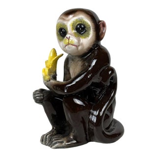 Mid-Century Japanese Porcelain Monkey Holding Banana Sculpture For Sale
