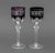 Group of Seven Bohemian Cut-Crystal Wine Glasses, comprising: (6) six in purple and (1) one dark ruby red. 8.75" H x 3"...
