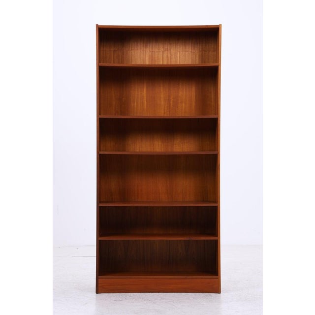 Vintage teak bookcase with clean proportions and beautiful grain. The open design offers plenty of space for books,...