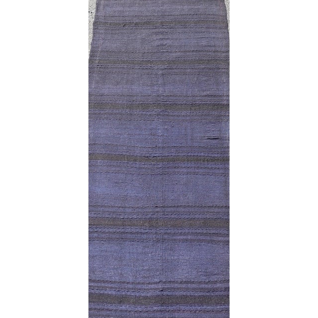 Measures: 2'2 x 7'4 This vintage Turkish Kilim runner presents a captivating design with deep blue and purple tones,...