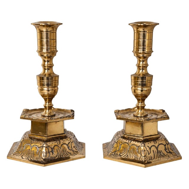 Pair of Swedish brass candlesticks by Ystad Metall, featuring sculptural hexagonal bases with finely detailed decorative...