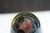 A one-of-a-kind glass vase by David Mackey in his signature paperweight style, signed and dated 1993. The piece swirls...