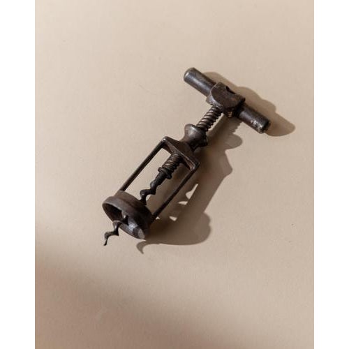 This vintage metal corkscrew from the 1930s features a classic form with a beautiful antique look that reflects early...