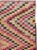 This mid-20th-century Turkish Anatolian accent rug presents a vibrant checkerboard composition built from small...